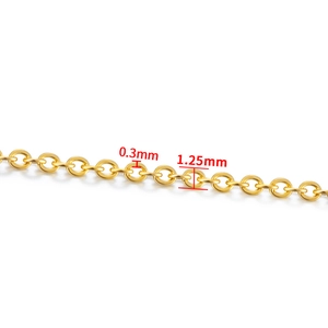 Macro detail of gold metal chain with 0.3mm wire diameter and 1.25mm outer diameter