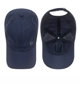 Detail showing the top and interior of dark blue quick-dry cap with laser-cut vents