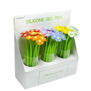 Macro view of boxed silicone clover flower gel pens with green leaf shaped barrels