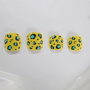 Short square leopard print press-on toenails in bright yellow and blue leopard pattern