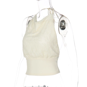 Detailed macro of a women's cream halter top featuring wave textured jacquard fabric texture