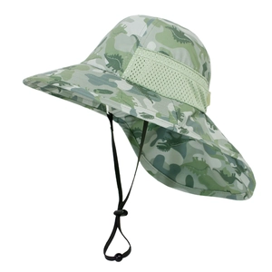 Close-up of children's sun hat with green dinosaur print and breathable mesh fabric