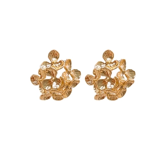 Elegant golden flower stud earrings with a matte textured finish on a white background