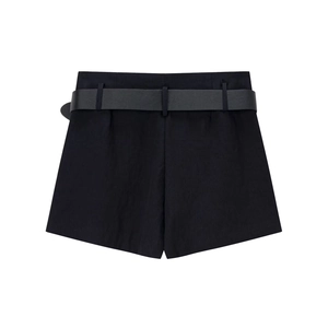 Women's minimalist black woven shorts with matching leather belt on white background