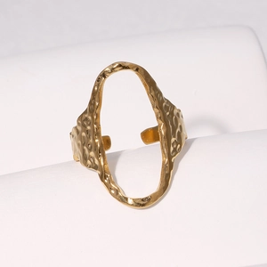 Polished gold hammered texture oval open ring on white curved display stand