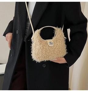 Detail of fuzzy lamb wool crossbody bag featuring a silver metal twist lock closure