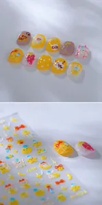 Detail of cute cat nail art stickers featuring stars, rainbows and heart patterns