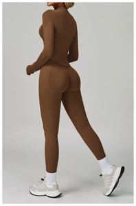 Detail of high-waisted seamless dark brown yoga leggings and long sleeve sports top set