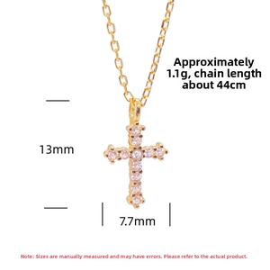 Detail of gold cross necklace with pink zircon stones, 44cm chain, 13mm pendant size
