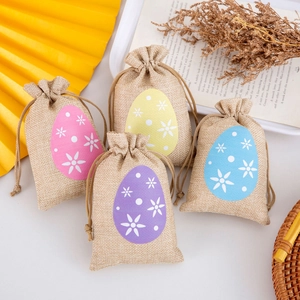 Set of four linen Easter egg drawstring bags in pink, yellow, purple, and blue colors