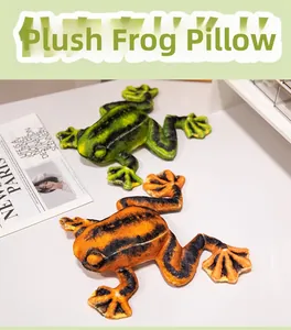 Detail showing green and orange spotted plush tree frog pillows in a home setting