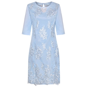 Detail of light blue mid-sleeve dress featuring white floral embroidery and cutout neckline