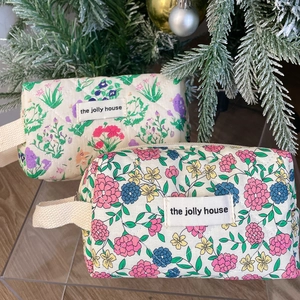 Vintage floral quilted cosmetic bag with woven handle for travel and storage organizer