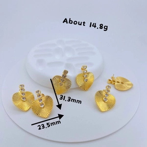 Retro gold heart-shaped hoop earrings with textured finish and zircon stones