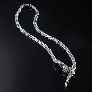 Detailed macro view of silver snake chain necklace with sparkling zircon rectangle gems
