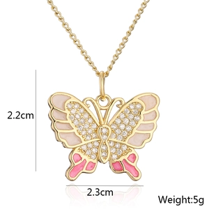 Detail showing 2.2x2.3cm 18K gold plated butterfly pendant with pink enamel and zircons