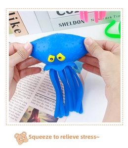 Close-up of hands squeezing a blue octopus squeeze toy with soft textured surface