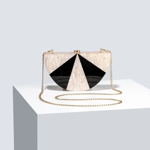 Women's semi-circle evening bag with pearlescent texture and black geometric patterns