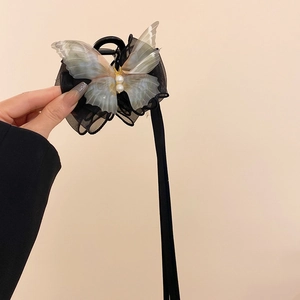 Elegant black tulle butterfly hair claw clip with iridescent wings and faux pearls