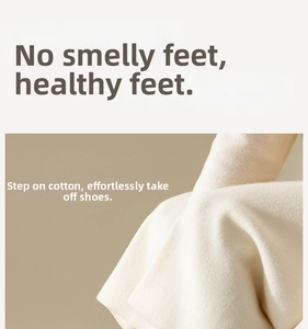 Macro shot of high-quality white cotton socks showing the ribbed knit texture and soft fabric