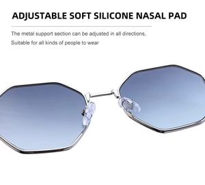 Macro view of adjustable silicone nose pads and silver metal frame on sunglasses