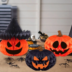 Halloween honeycomb paper decorations featuring orange and black pumpkin with wizard hat