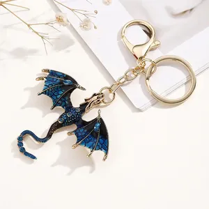 Detail of blue enamel dragon keychain with gold-plated lobster clasp and sparkling crystals