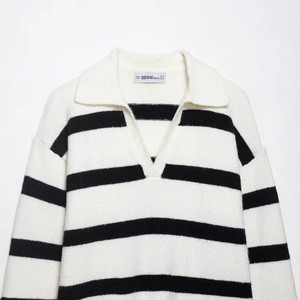 Classic black and white striped long sleeve knit polo sweater with V-neck collar