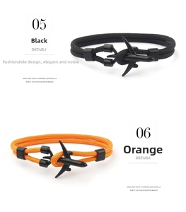 Detail of woven bracelets in black and orange with matte aircraft buckle closures