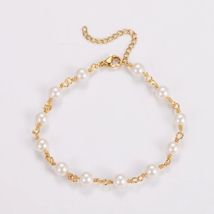 Close-up of baroque pearl bracelet with gold links and adjustable lobster clasp