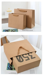 Detail showing thick brown kraft paper gift bags with twisted handles in a lifestyle setting