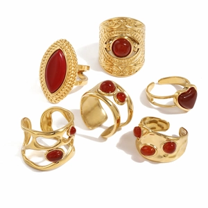 Retro style set of six golden rings with red onyx stones in various elegant shapes