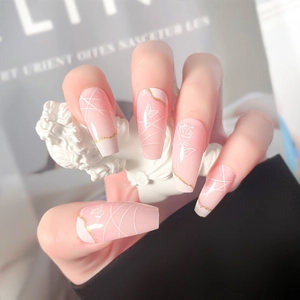 Detailed view of long ballerina press-on nails with pink gradient and rose butterfly art
