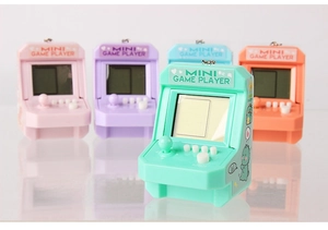 Mini retro arcade game handheld consoles in mint green and assorted candy colors