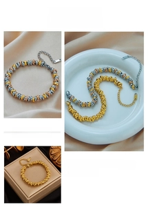 Macro detail of multi-strand twisted knot metal bracelets with adjustable clasp