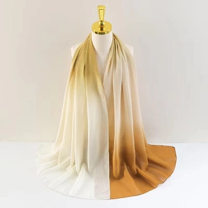 Detail of gradient chiffon scarf showing smooth brown to cream color transition