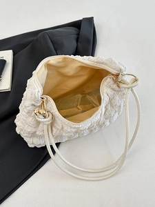 Minimalist white bubble textured puff shoulder bag with yellow lining and metal zipper