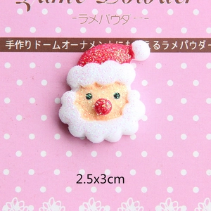 Macro detail of glittery Santa resin charm for DIY phone case crafts, 2.5x3cm size