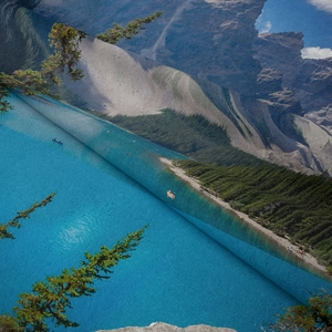 Close-up of soft bohemian landscape tapestry fabric with mountain and lake print texture