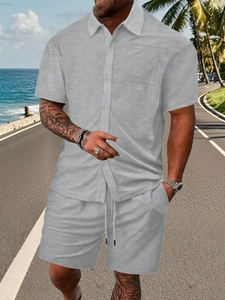 Detail of grey men's short sleeve shirt and shorts set with textured summer fabric