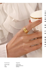 Chic 18K gold plated woven knot ring shown on model holding a coffee cup in daily life