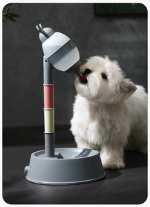 Adjustable vertical pet water dispenser with multi-color stand and base shown in use by dog