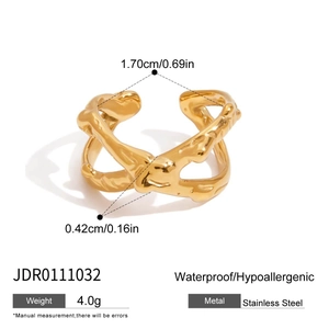 Macro detail of golden stainless steel ring showing exact measurements and 0.42cm band width
