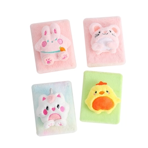 Detail of four colorful plush notebooks featuring cute 3D bunny and unicorn animal designs