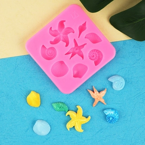 Pink sea life silicone mold for starfish and seashell clay crafts and fondant cake decor