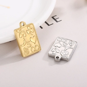 Engraved gold and silver stainless steel rectangle pendants with unicorn and heart motifs