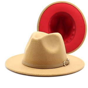 Close-up of wool fedora hat with camel exterior and vibrant red underbrim detail