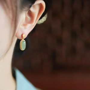 Vintage Hetian jade drop earrings with matte gold floral enamel and elegant long tassels