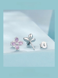 Detailed close-up of S925 sterling silver lilac flower stud earrings with purple enamel