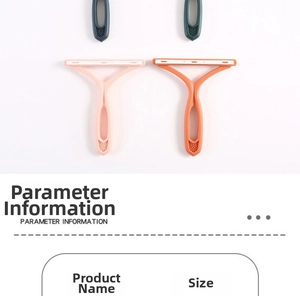 Detail view of portable manual lint removers with Y-shaped handles in pink and orange